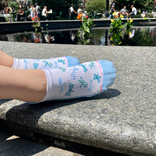 Woman wearing ankle compression socks during everyday activities