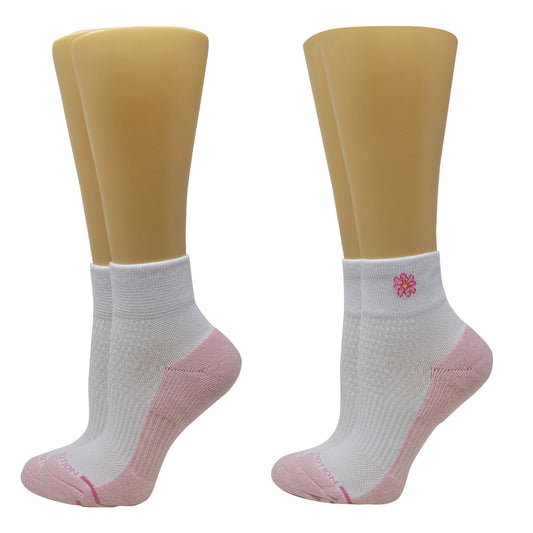 White Quarter Compression socks with pink accents on mannequin feet against a white background