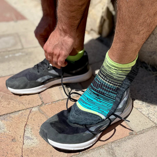 Man wearing Dr. Motion ombre ankle compression socks for everyday comfort and circulation support