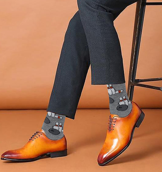 Men wearing patterned sports socks at home