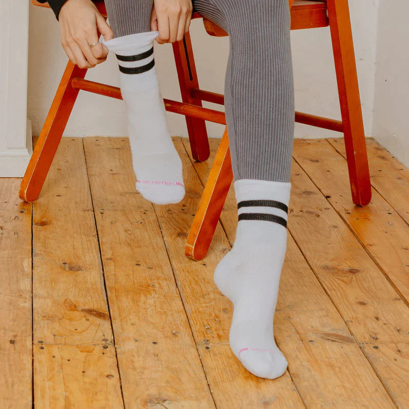 A woman wearing Dr. Motion Crew Compression Socks