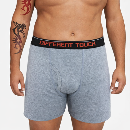 Man wearing gray boxer briefs with a 'Different Touch' waistband on a white background