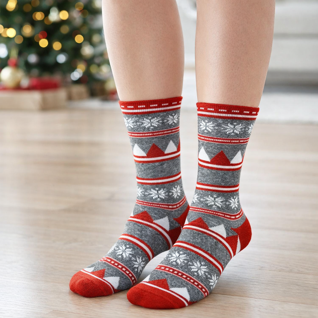 Person wearing festive patterned Crew socks with a blurred Christmas tree in the background