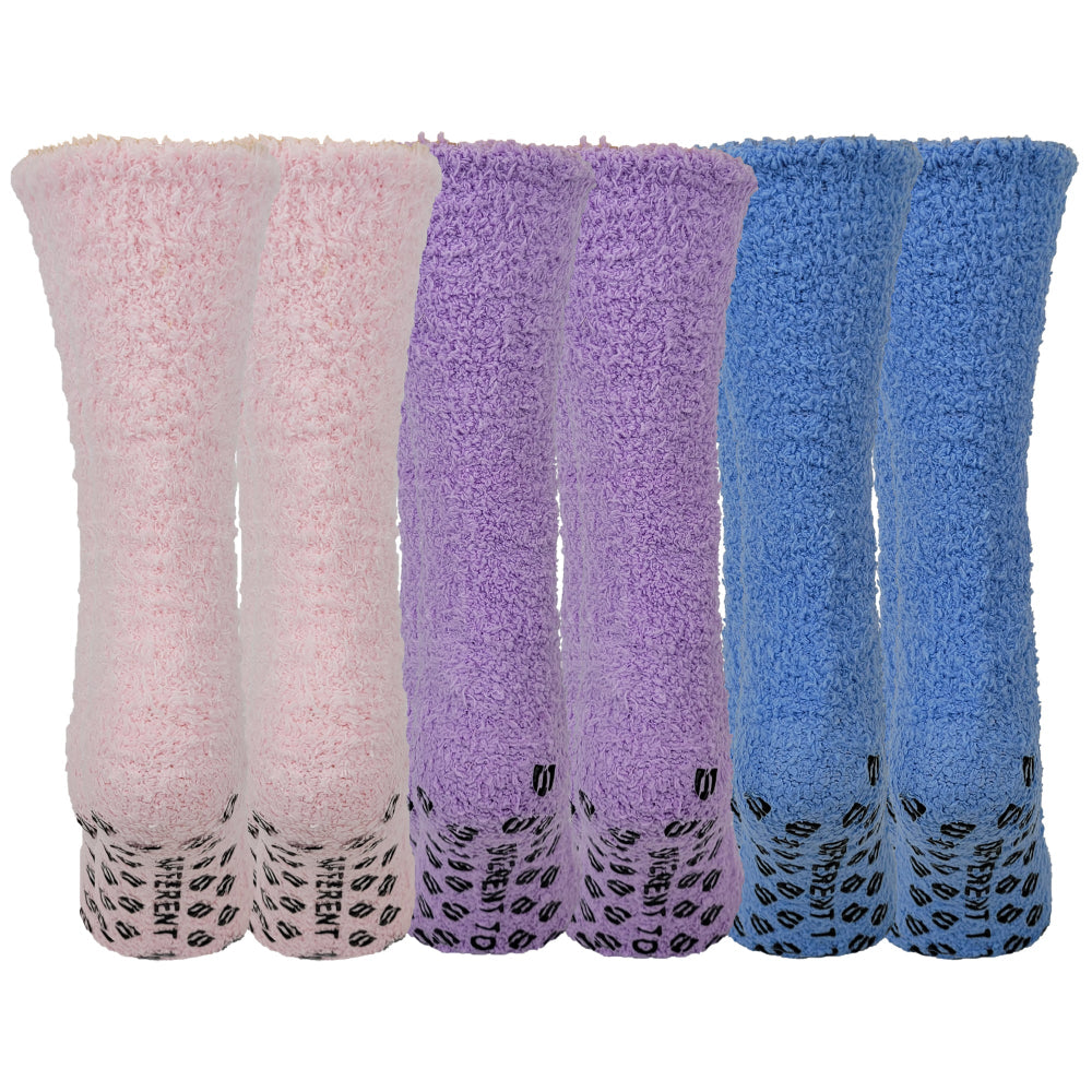 Three pairs of fuzzy socks in pink, purple, and blue on a white background.