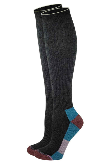 A pair of Dr. Motion knee-high compression socks in solid black color with a textured pattern, featuring a smooth toe and color-blocked heel and toe design.
