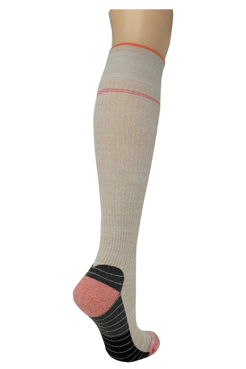 Beige knee-high sock with pink accents on a mannequin leg against a white background