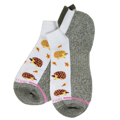 Two pairs of socks with hedgehog pattern on a white background