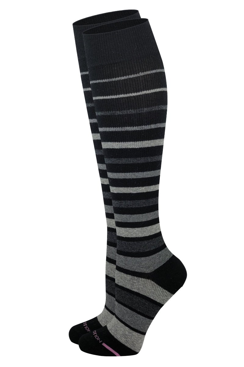 Close-up of striped compression knee-high socks showing smooth toe seam and cushioned comfort