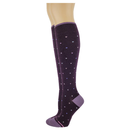 Purple knee-high compression sock with white polka dots on a mannequin leg against a white background