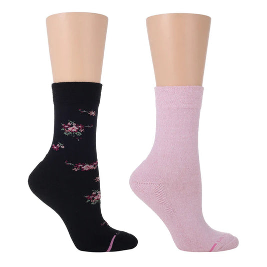 Two pairs of women's diabetic Dr. Motion socks, one in black with pink flowers and the other in pink solid color, displayed on mannequin legs.