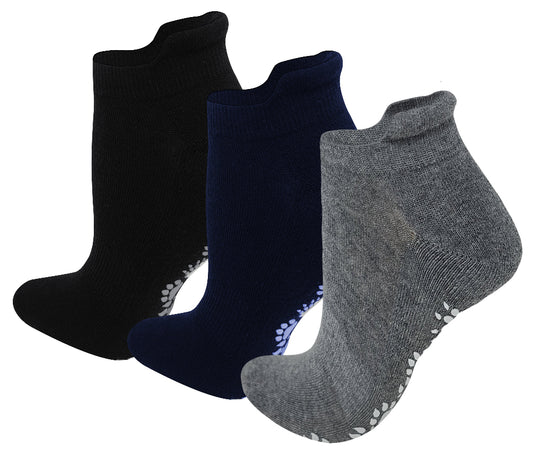 Three pairs of unisex low cut cushion socks with grips, displayed in black, blue, and grey colors, intended for non-slip activities like yoga and Pilates.