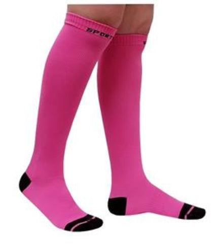 Athlete wearing knee-high compression socks during workout and training.