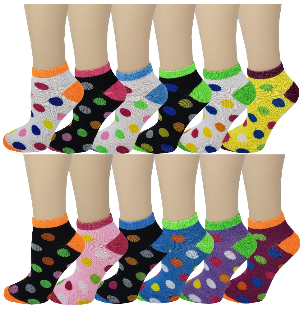 An assortment of colorful low cut ankle socks with polka dot patterns displayed on models' feet.